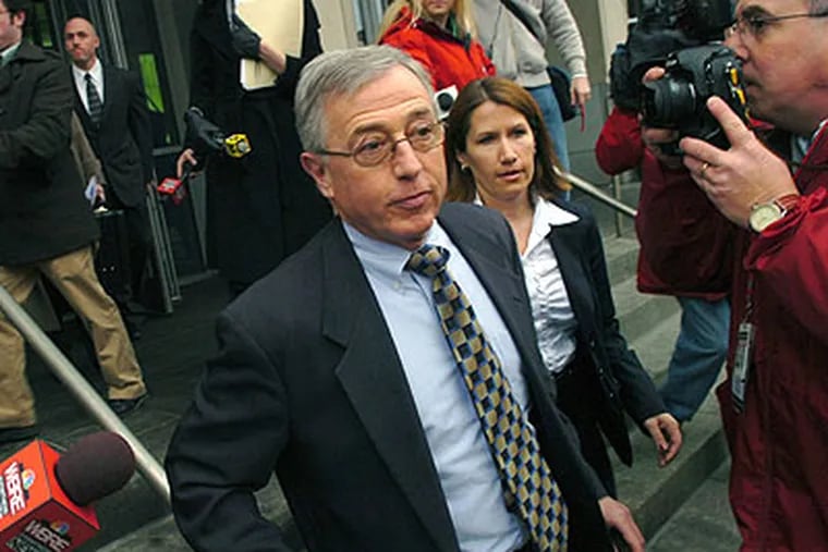 In this Feb. 12, 2009, file photo, Mark Ciavarella, center, leaves the federal courthouse in Scranton, Pa. Two former Pennsylvania judges, Michael Conahan and Ciavarella, were indicted on federal racketeering charges for improperly placeing juveniles in privately owned detention centers. (AP Photo / David Kidwell)