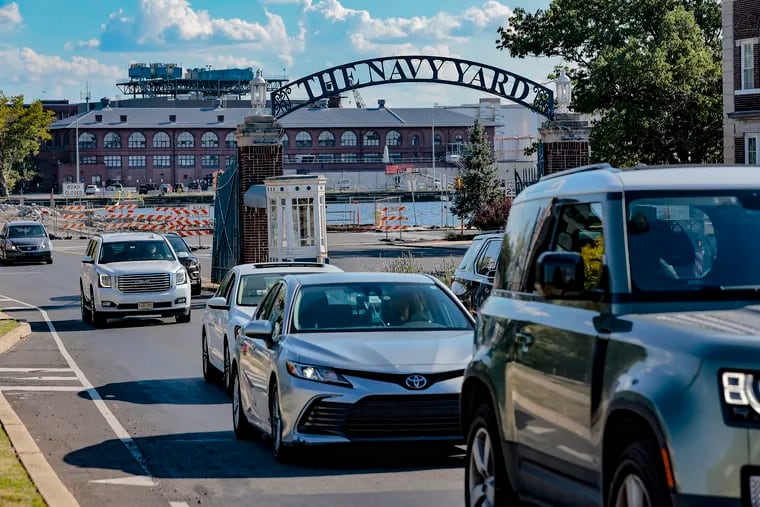 People leave the Navy Yard at rush hour on a Thursday. Driving is slower than biking, one worker said, but it's safer.