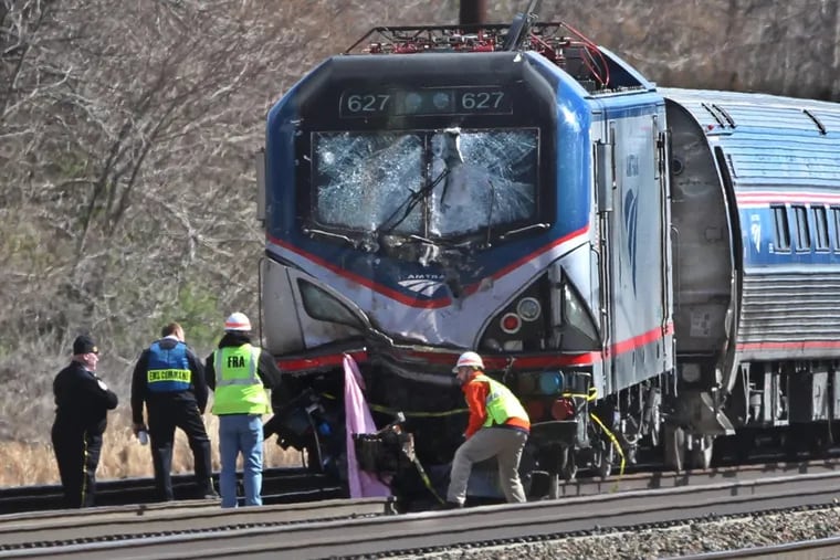 The front of the derailed locomotive of the Amtrak Train #89 that struck a backhoe on the southbound track , killing two Amtrak employees.