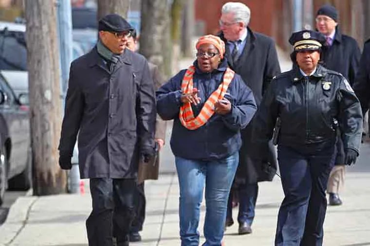 Superintendent William R. Hite Jr., left,  talks to Sylvia Simms, a SRC member, center, and Chief Inspector Cynthia Dorsey, of School Safety, as they take a walk through the neighborhood from 19th and Lehigh to Rhodes Elementary , at 2900 Clearfiled Ave. The walk took around 35 minutes and was 1.2 miles long.     Parents, students and community members are worried about some of the long, dangerous walks students would have to take to get to their new schools if 29 Philadelphia schools close in June. At the most recent SRC meeting, one parent begged Superintendent William R. Hite Jr. to take the walk his child would have to take, from T.M. Peirce in North Philadelphia to the Rhodes School, over a mile away. The newest SRC member, Sylvia Simms, asked too - her granddaughter goes to Peirce.  03/01/2013  ( MICHAEL BRYANT / Staff Photographer  )