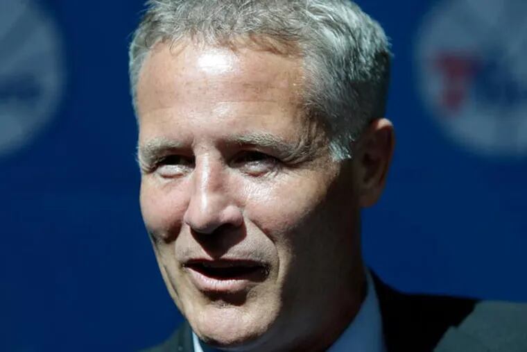 76ers incoming head coach Brett Brown smiles at the end of a news conference, Wednesday, Aug. 14, 2013, in Philadelphia. Brown's hire ended a four-month search to replace Doug Collins. (Matt Rourke/AP)
