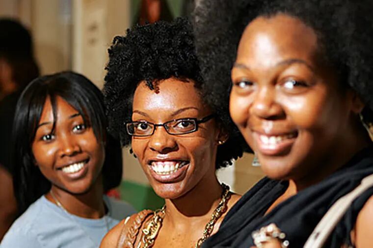 From left, Chyna Branche, 25, Glennine Williams, 24, and Ruth Oliver, 24, take different approaches to their hair. (David Swanson / Staff)