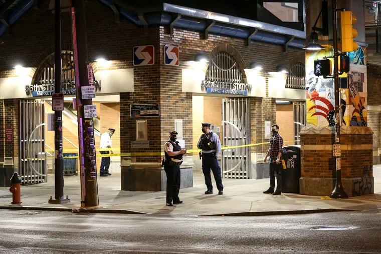 Police on the scene of a quadruple shooting at 56th and Market Streets Friday night.