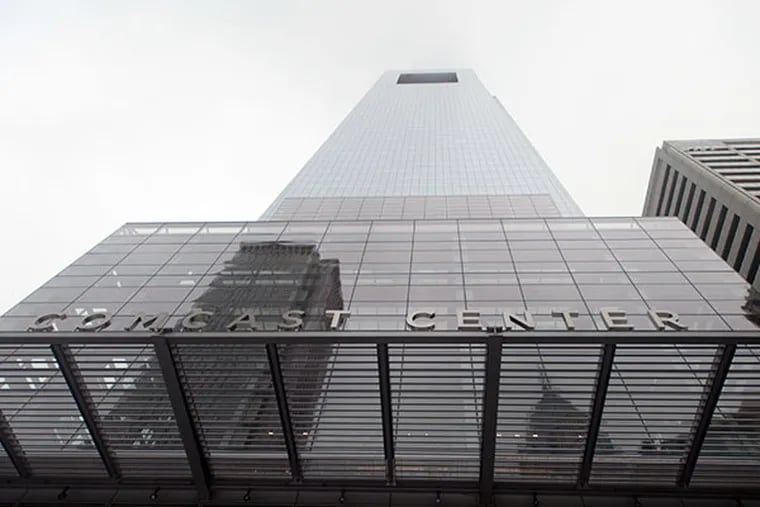 The Comcast Center looms large in Center City. Comcast's reach will face new scrutiny April 9 as a Senate committee begins hearings on the company's proposed Time Warner Cable purchase.