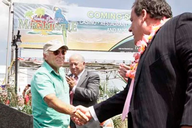 Jimmy Buffet (left) and Gov. Christie during the announcement that Buffet is bringing his Margaritaville-themed restaurant, bar and surf shop to Resorts Casino in Atlantic City. July 24, 2012.  ( ELIZABETH ROBERTSON / Staff Photographer )