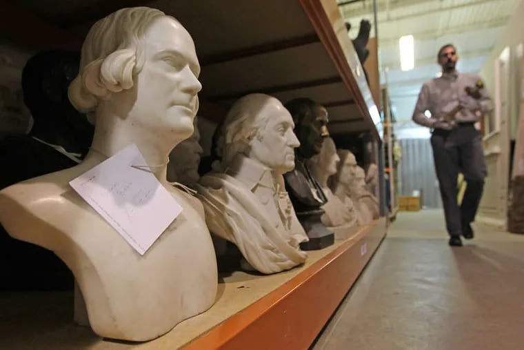 A bust of Nicholas Biddle (left) in storage. It has been on view at the Philadelphia History Museum on South Seventh Street, but has spent much of the last decade in storage.