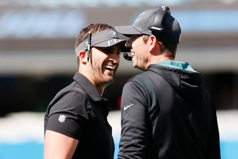 Eagles Head Coach Nick Sirianni with Offensive Coordinator Shane Steichen share a laugh before a game against the Carolina Panthers on Sunday, October 10, 2021 in Charlotte.