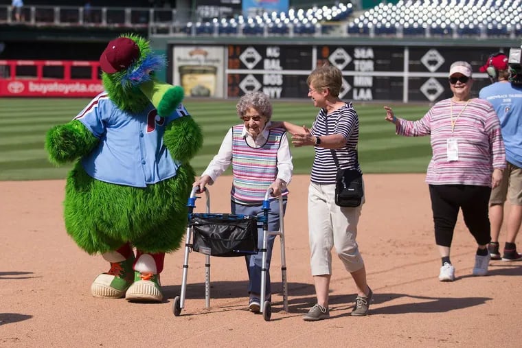 Seniors get to stroll the bases at a Phillies baseball game.
