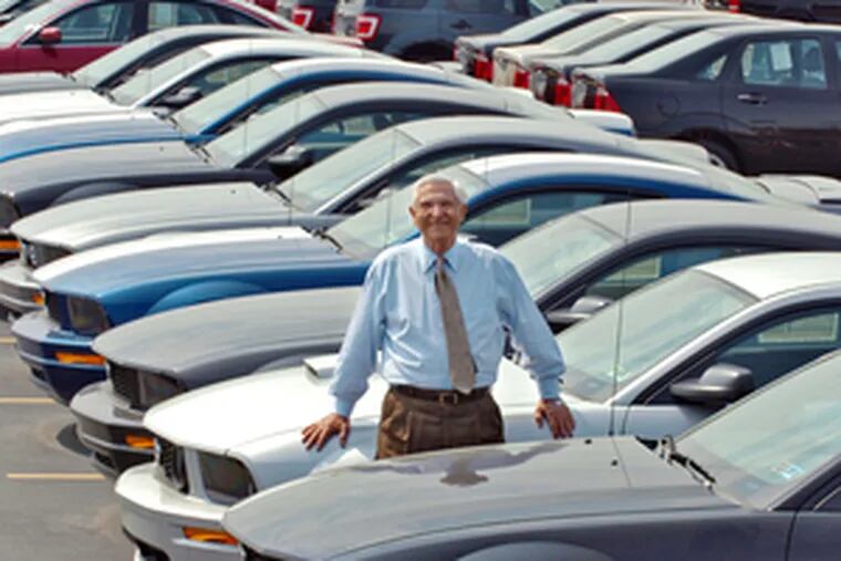 Ford dealer Kerry T. Pacifico, 83, in one of his lots near the airport. &quot;We&#0039;re on an upswing. We can&#0039;t go any lower. Other dealers are closing and that will help us,&quot; said Pacifico, who started in the business in 1954.