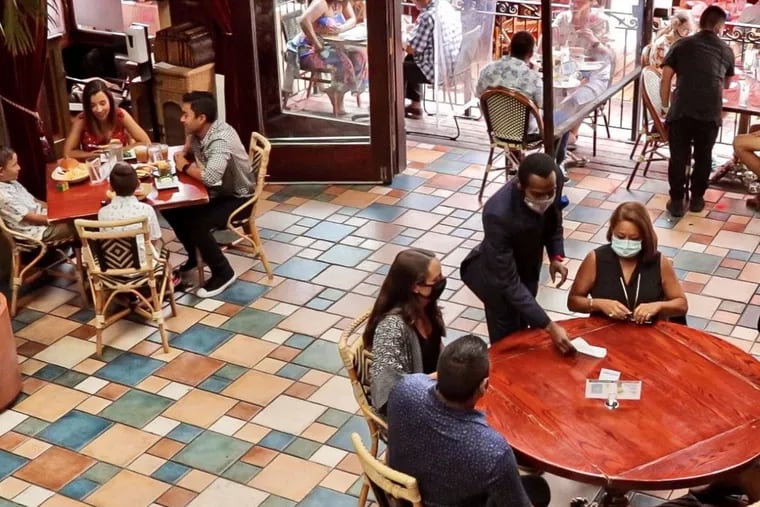 Patrons dine at Cuba Libre restaurant in Old City in 2020. The restaurant has planned special events for Mother's Day weekend. Cofounder Barry Gutin says that the company uses holidays as an opportunity to engage with customers.
