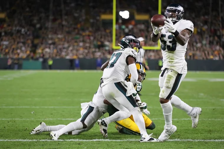 Philadelphia Eagle Nigel Bradham, right, intercepts the ball intended for a Packers wide receiver Marques Valdes-Scantling with 20 seconds left in the game. The play sealed the Eagles 34-27 victory over the Packers on Lambeau Field on Thursday, September 26, 2019.