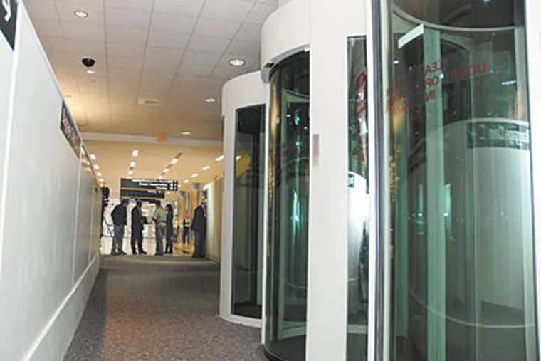 Electronic security pods are installed at Atlantic City International Airport, which has aviation research facilities nearby. (RICH KRENTS / For The Inquirer)