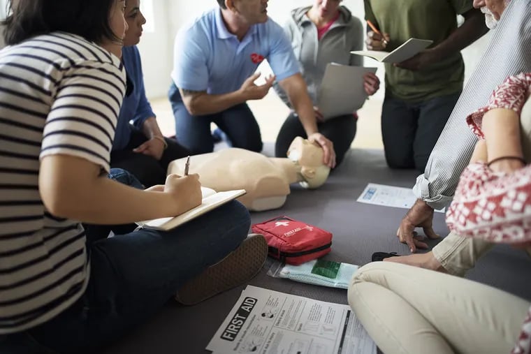 Students learn hands-only CPR.