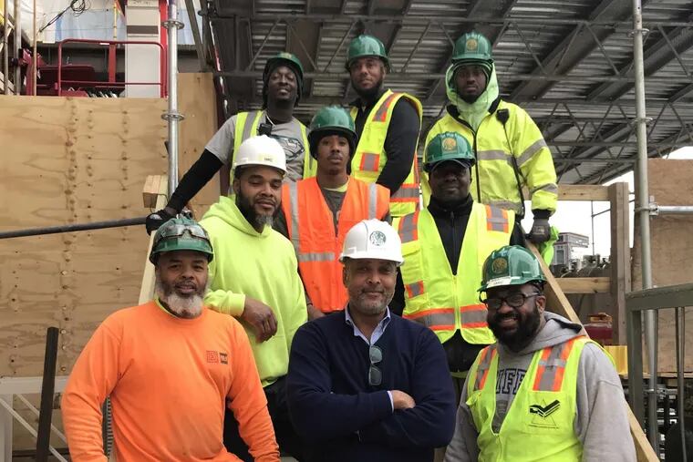 Pride Enterprises, Inc. is a black-owned building, construction management, and consulting firm. Craig Williams, center, is the CEO.