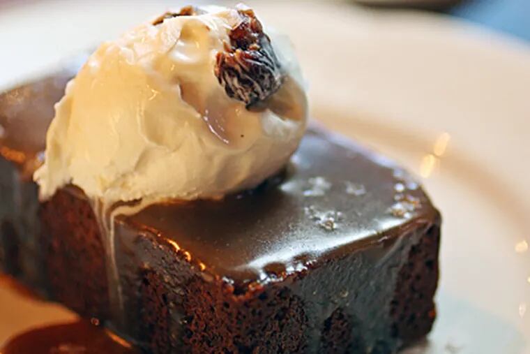 Sticky toffee pudding, a sensuous caramel-soaked sherry date cake topped with ice cream, has universal appeal. (Michael Bryant / Staff Photographer)