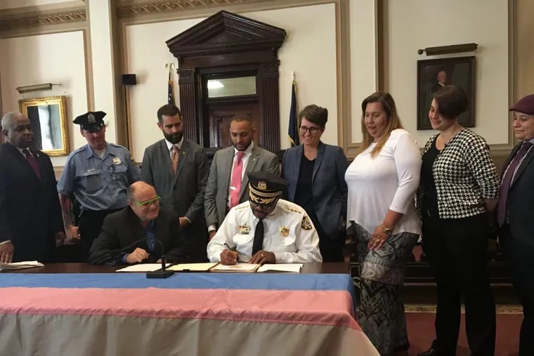 Sheriff Jewell Williams signs the policy on how deputies should treat transgender individuals.