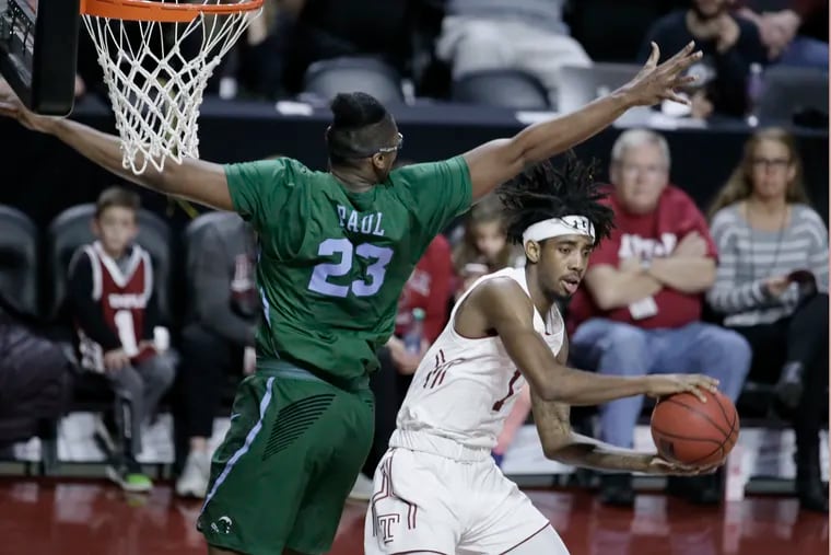 Temple's Quinton Rose (right), looking to pass against Tulane, had a strong outing vs. the Green Wave.