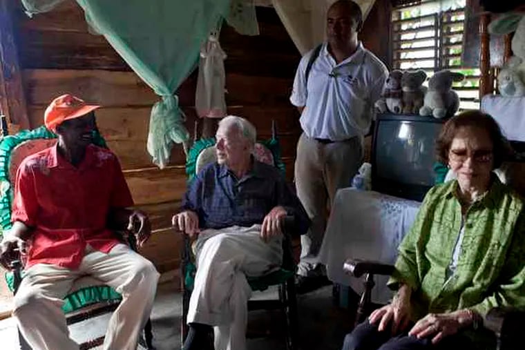 Former President Jimmy Carter and his wife, Rosalynn, with Juan Taveres in Dajabon, Dominican Republic. He's logged millions of miles mediating conflicts and advocating for human rights.