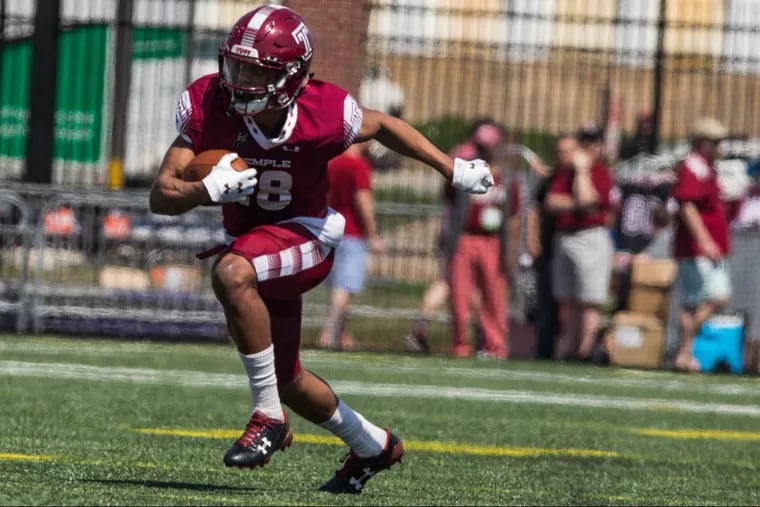 Temple’s wide receiver Jadan Blue, on the Cherry team, runs with the ball during the team’s spring football game.