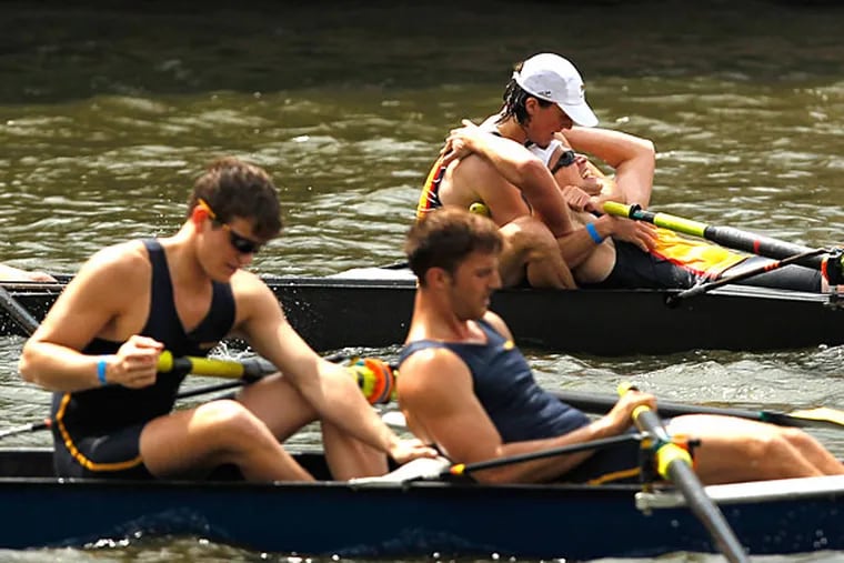Drexel's (background) rowers (background) celebrate the team's victory. (Ron Cortes/Staff Photographer)