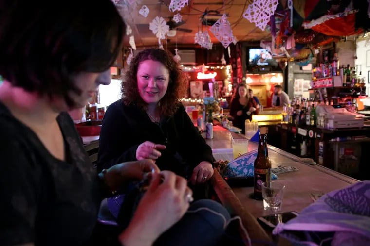 Heather Cochran, left, of Philadelphia, and Jenn Griffith, right, wanted to spend a little time at Dirty Franks bar to honor their friend Sheila Modglin, alLongtime Dirty Franks bartender who was struck by a car late Thursday night.