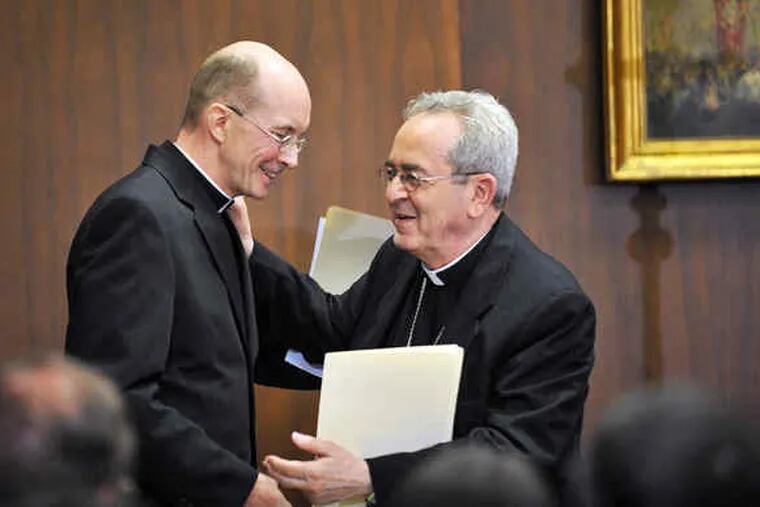 Cardinal Justin Rigali (right) with Msgr. Timothy C. Senior. The cardinal has not yet identified Senior's new duties as an auxiliary bishop of Philadelphia's Roman Catholics.