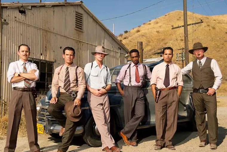 This film image released by Warner Bros. Pictures shows, from left, Giovanni Ribisi as Officer Conwell Keeler, Josh Brolin, as Sgt. John O'Mara, Ryan Gosling as Sgt. Jerry Wooters, Anthony Mackie as Officer Coleman Harris, Michael Pena as Officer Navidad Ramirez and Robert Patrick as Officer Max Kennard in ìGangster Squad." (AP Photo/Warner Bros. Pictures, Wilson Webb)