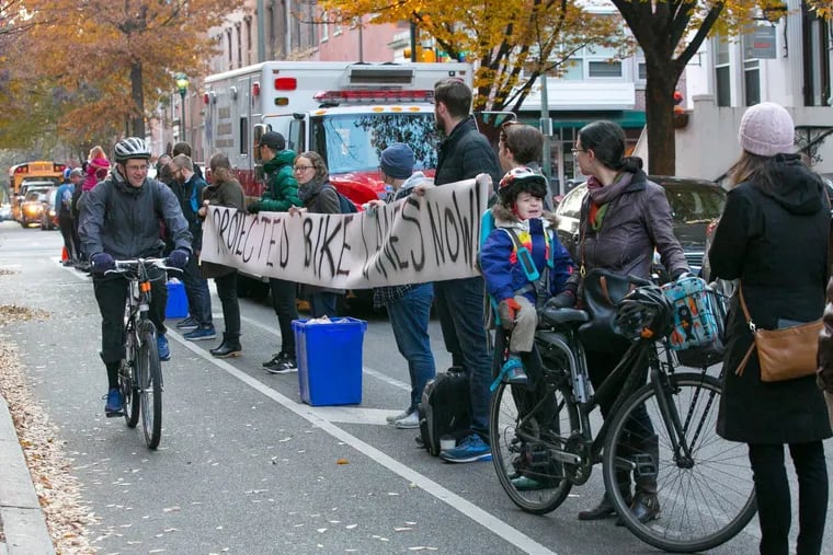 Protesters advocate for safer bike lanes by lining up at 11th and Spruce Streets, shortly after a bicyclist was killed nearby in November 2017.