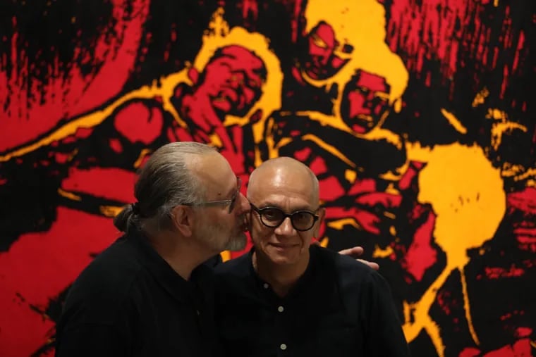 Curators David Acosta (left) and Janus Ourma at Drexel University's art exhibition celebrating the 50th anniversary of Stonewall.