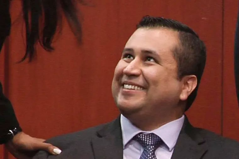 George Zimmerman smiles after the jury delivered a not-guilty verdict in the slaying of Trayvon Martin.