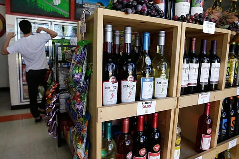Washington stores that cater to bargain-hunting Canadanians - beer and wine are cheaper in the U.S. - worry about a proposed fee that would be placed on travelers entering the country by land. (AP)