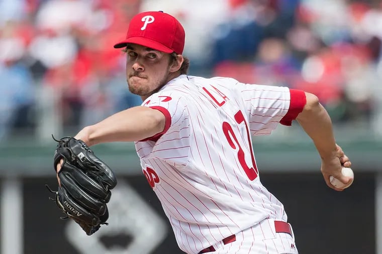 Philadelphia Phillies starting pitcher Aaron Nola (27) throws a pitch during the first inning of an opening day baseball game against the San Diego Padres, Monday, April 11, 2016, in Philadelphia.