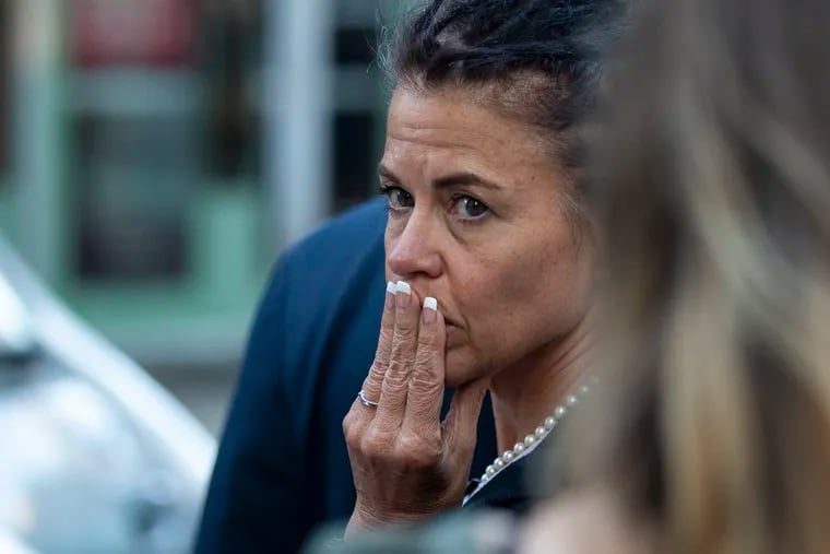 Linda Schellenger, mother of Sean Schellenger, who was fatally stabbed near Rittenhouse Square, leaves the Stout Center for Criminal Justice after the opening of the trial of his alleged killer, Michael White, on Thursday, Oct. 10, 2019.