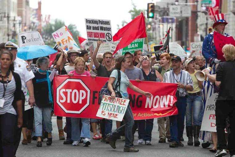 Anti-fracking protesters march at the 2011 Shale Insight conference in Philadelphia. Attendees at the 2020 conference, which was conducted virtually online because of the pandemic, were told that the shale gas industry faces an existential political threat from anti-fossil fuel activists.