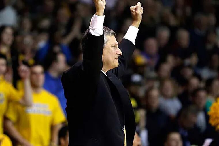 La Salle head coach John Giannini reacts after a basket during the second half of an NCAA college basketball game against Butler, Wednesday, Jan. 23, 2013, in Philadelphia. La Salle won 54-53. (Matt Slocum/AP)