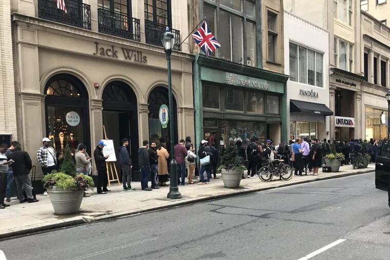 Customers line up for the iPhone X on Walnut Street in Center City.