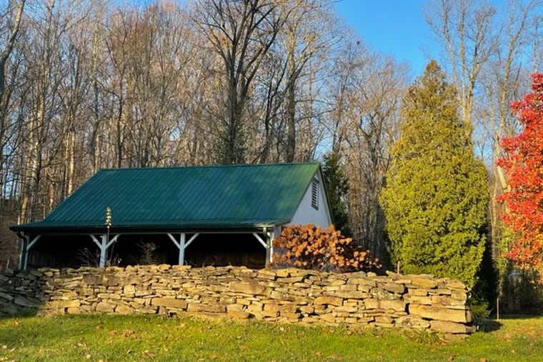 A rock wall contains the author's compost pile in Western Pennsylvania.