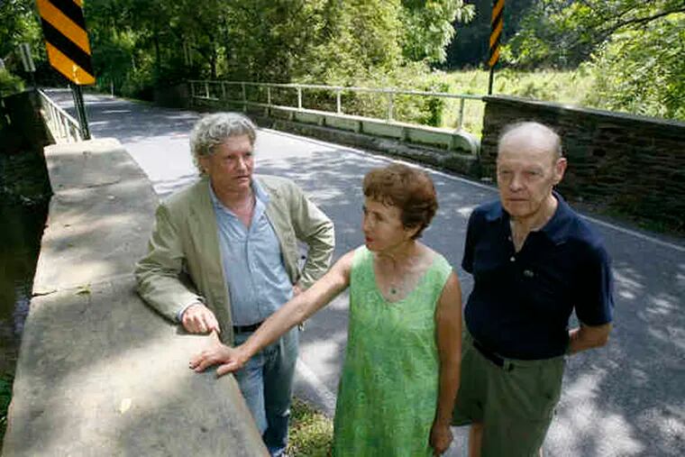 Neighbors of the bridge, including Tom Brokaw (left) and Sandy and Tom Mills, are fighting to save it.