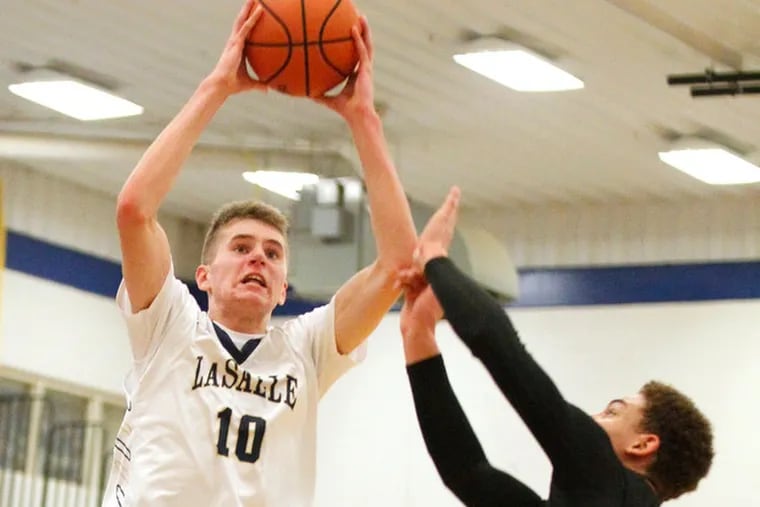 La Salle's Konrad Kiszka (left) made national news on ESPN Friday with a thundering dunk. Here he is shown playing against Nate Barnes of Carlisle in 2016.