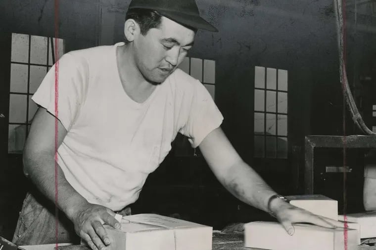 George Sakamoto, a California fruit worker before the Pearl Harbor attack, packages beans at Seabrook Farms, where some internees were sent.