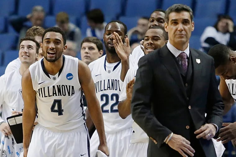 Villanova's Darrun Hilliard II (4) celebrates with teammates during second half of a second-round game against Milwaukee in the NCAA college basketball tournament in Buffalo, N.Y., Thursday, March 20, 2014. Villanova won 73-53. (Nick LoVerde/AP)