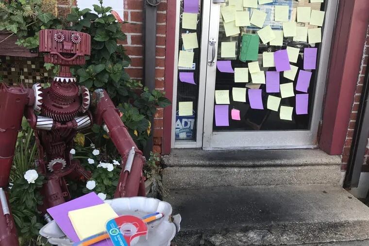 Post-It notes of condolence have papered over the entrance of Coffee House Too since the sudden death of co-owner Sal Licastri.