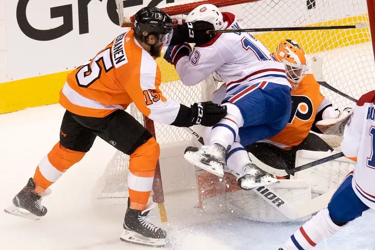 Montreal Canadiens center Max Domi picked up a goaltender interference penalty as he was driven into Flyers goaltender Brian Elliott  by defenseman Matt Niskanen  during Game 2.