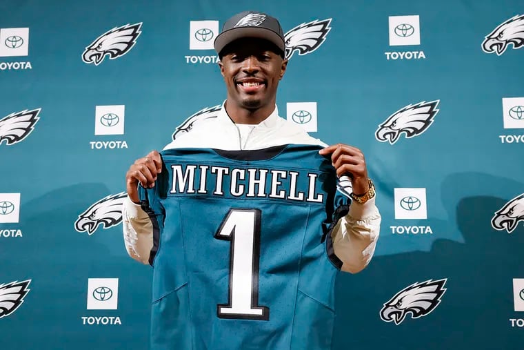 Eagles first-round draft pick, cornerback Quinyon Mitchell, holds his Eagles jersey during an introductory press conference at the NovaCare Complex Friday;