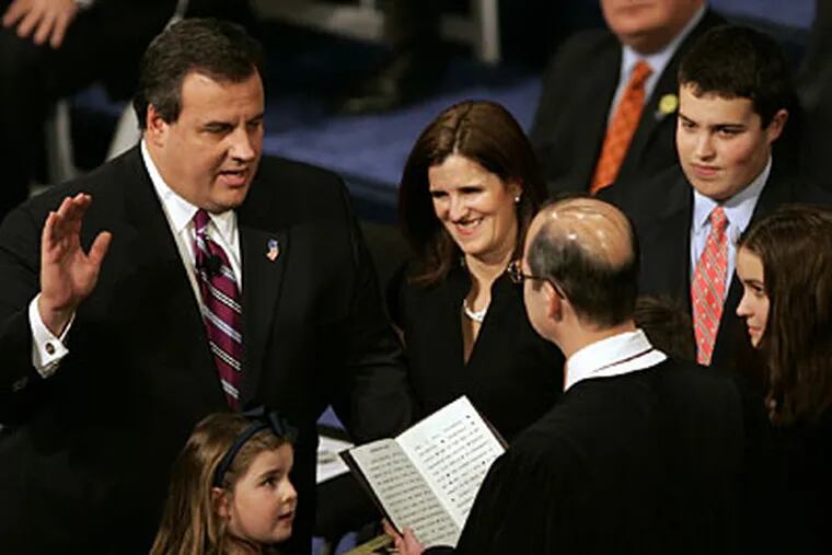 Chris Christie is sworn in as governor of New Jersey by the
Honorable Stuart Rabner, Chief Justice, New Jersey Supreme Court as
his wife Mary Pat and children look on. (AP Photo/Rich Schultz)