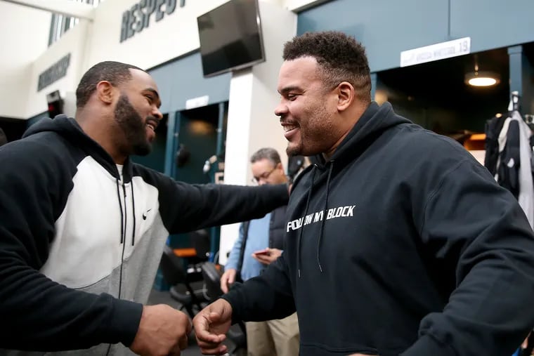 Brandon Brooks, right, was just about to embark on shoulder surgery rehab when he and Brandon Graham bid farewell for the offseason in the NovaCare locker room on Jan. 6. Now, Brooks will miss the season with an Achilles tear.