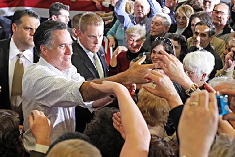 Mitt Romney greets supporters after speaking at a family-owned company in Broomall. The president, he said, is &quot;crushing dreams, he's crushing the dreamers, he's crushing the middle class.&quot; DAVID M WARREN / Staff Photographer