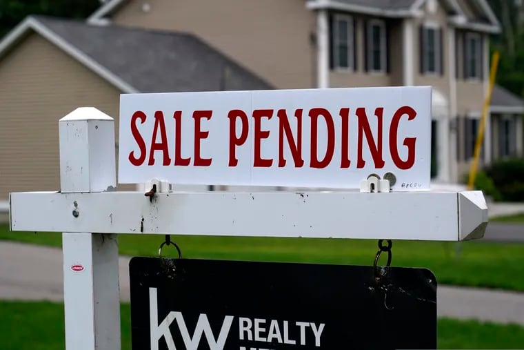 A "sale pending" sign is posted outside a single family home. The nationwide jump in mortgage rates this year has eroded purchasing power for home buyers. Rising rates will soften buyer demand and start to cool the housing market.