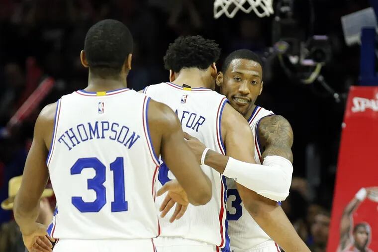 Sixers' Robert Covington celebrates a fourth-quarter three point basket with teammates Jahlil Okafor and Hollis Thompson against the Brooklyn Nets on Saturday, February 6, 2016 in Philadelphia.