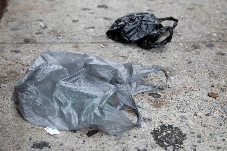 Plastic bags lay on a Center City Philadelphia sidewalk.